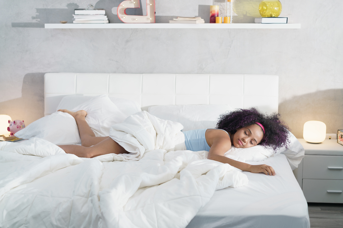 black woman sleeping alone in large bed NF5HJ2E from The Plus Addons for Elementor