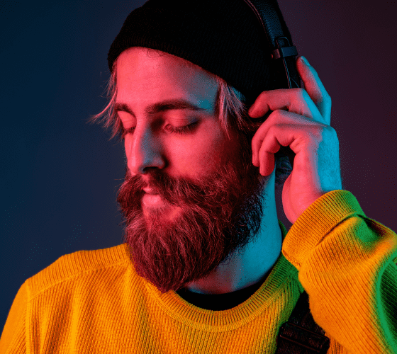Demo - A Men With Beard Listing Music With his Headphones