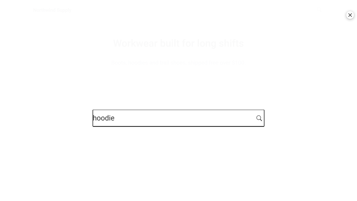Full-screen search overlay opened from the header search icon, with a search term typed in